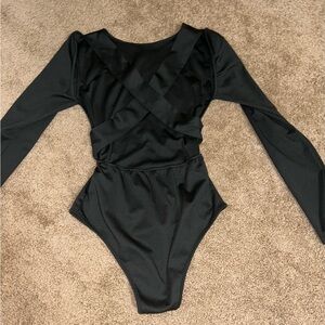 Black backless woman’s bodysuit